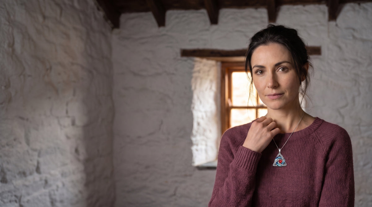 Woman wearing the witch knot necklace in an old stone cottage