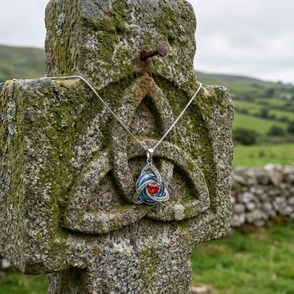 The witch knot necklace on an ancient carved Celtic stone